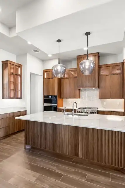 Fluted island & walnut cabinets